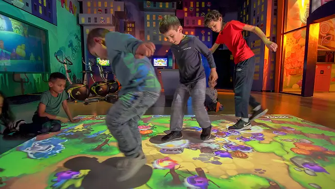 Kids playing on an interactive floor