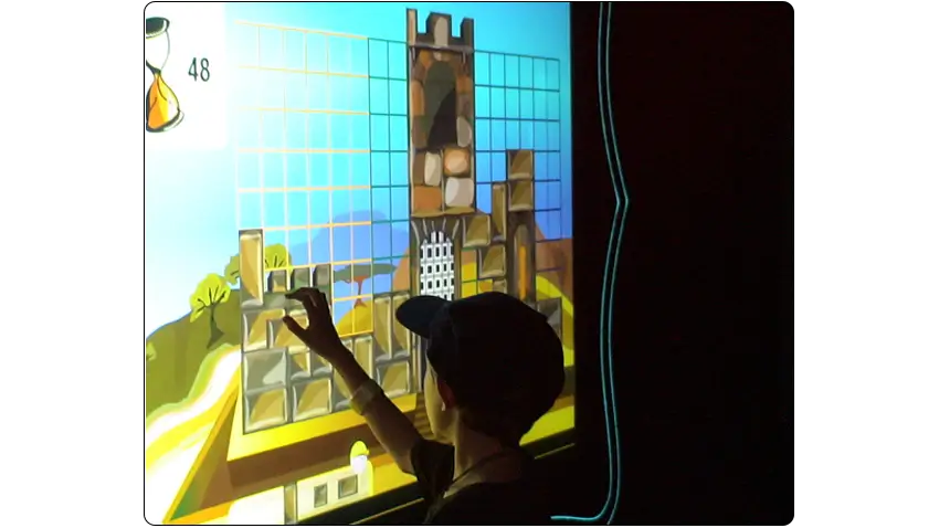 Kids using an EyeClick interactive projector